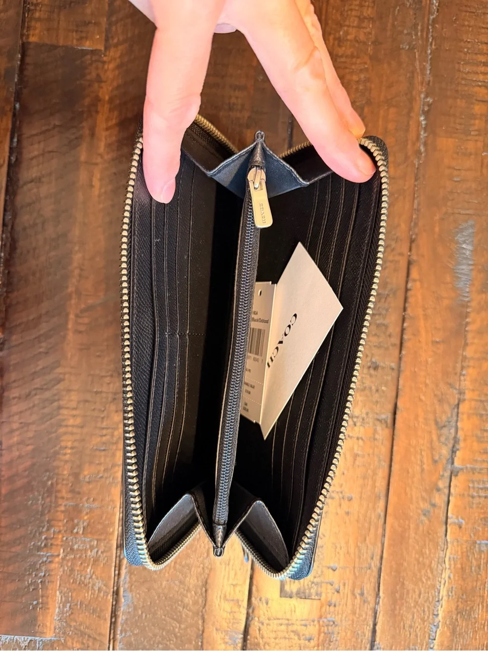 COACH Black Pebbled Leather Zip Wallet with Gold Logo